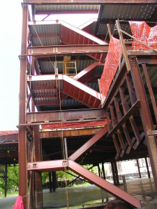 Double structural steel cement pan institutional staircase with steel framed landing, welded galvanized decking, and hanger rods. (Bronx, NY)
