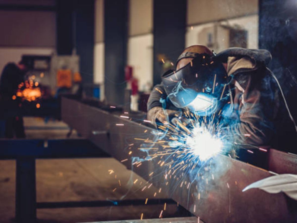 Steel Masters NYC welder fabricating structural steel in the Brooklyn shop