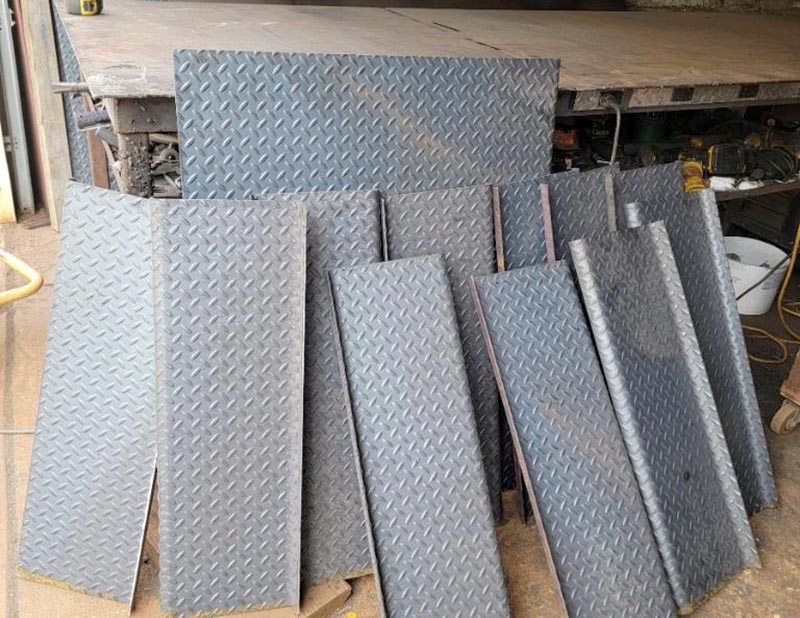 Structural metal diamond plate stair pans with bullnose landing