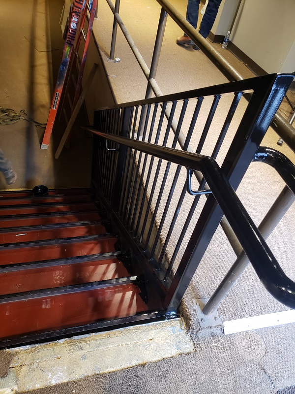 dan 8 code compliant metal staircase guardrailing with pipe handrail and ada loop. (1)