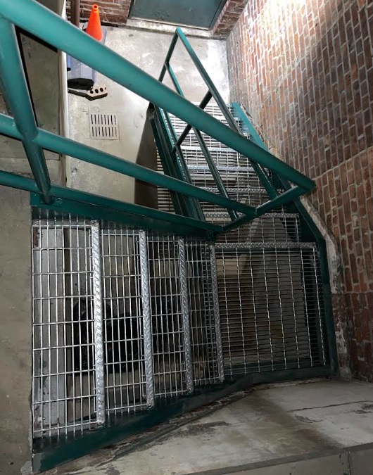 Galvanized steel fire stairs with mid landing and pipe railing, Midtown Manhattan
