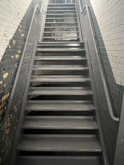 Grey interior open tread metal steps