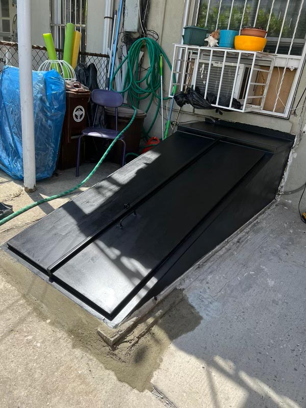 Huge waterproof bulkhead door — rear of building basement access