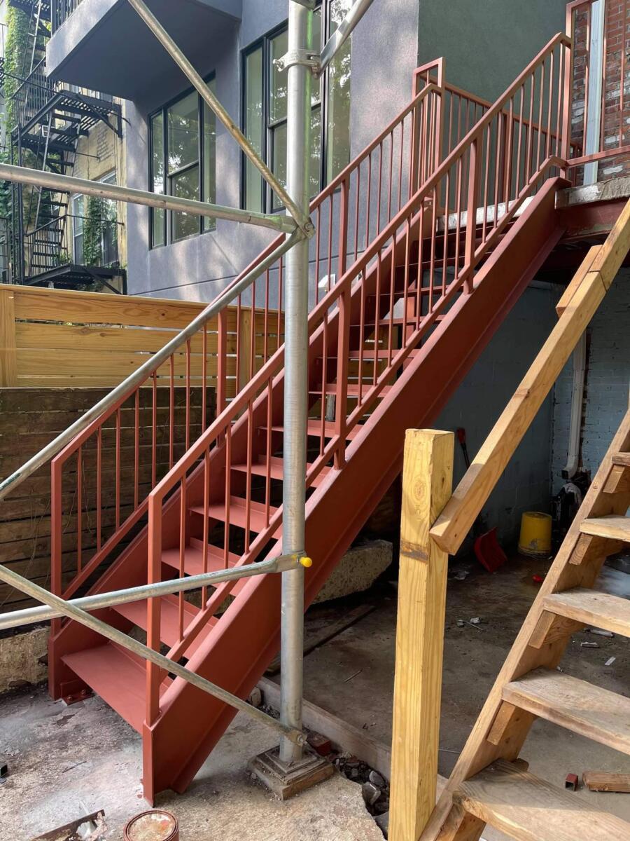 metal stairs with round bar and tube railings