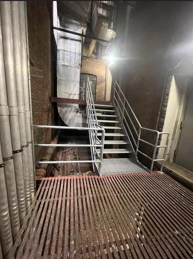 Galvanized metal grating staircases with ADA pipe railings, Midtown Manhattan