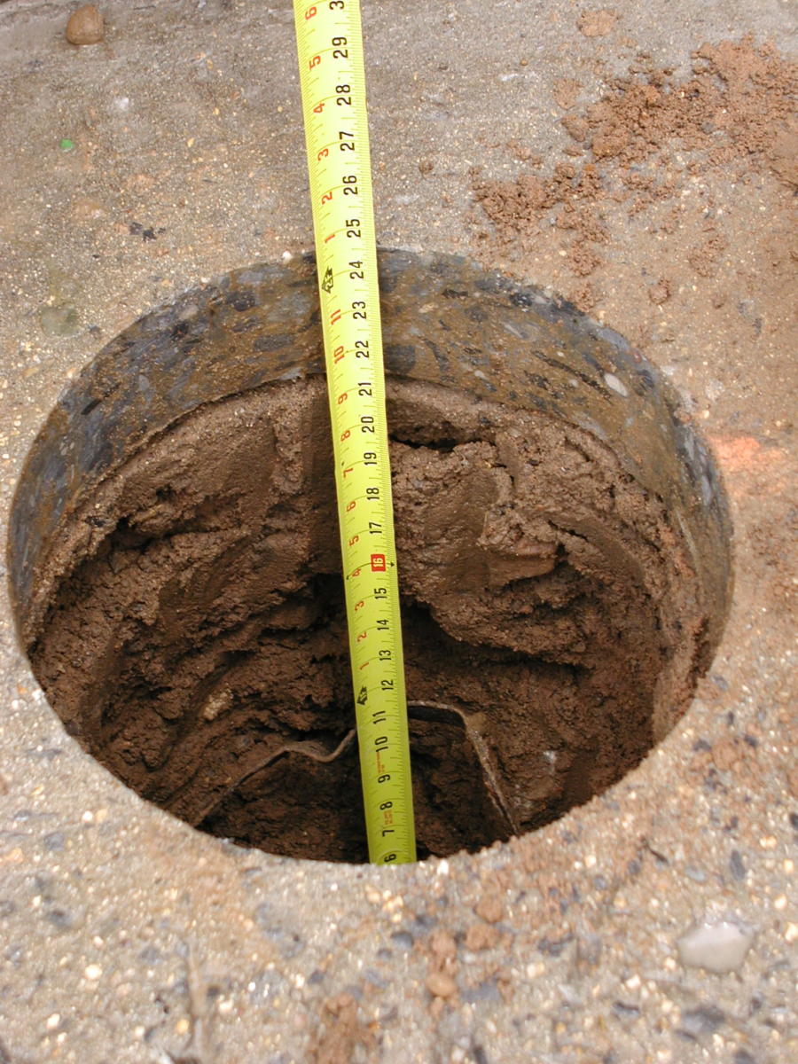 half foot coredrilled footing prepped for cement for fence posts or beams