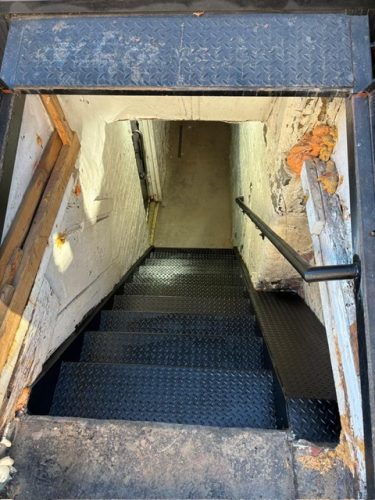 basement access street sidewalk steps stairs staircase metal iron steel