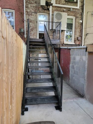Metal open tread stairs square diamond plate steel landing tube steel supports manhattan harlem new york
