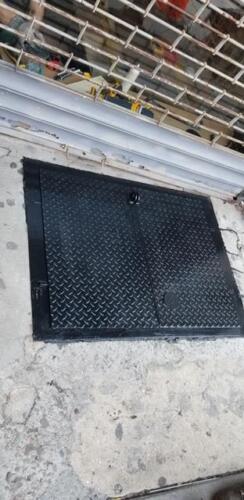 Metal sidewalk hatch for coal chutes, bed stye brooklyn bedford