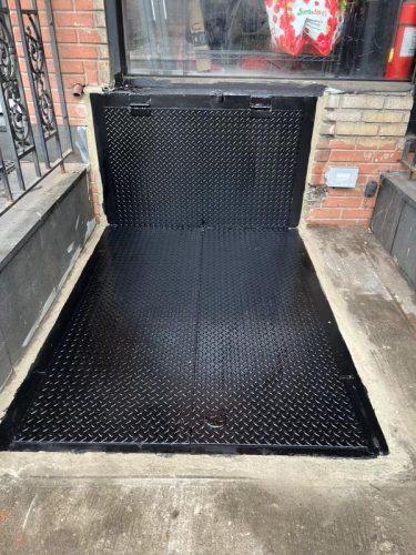 oversized hatch cellardoor sidewalk