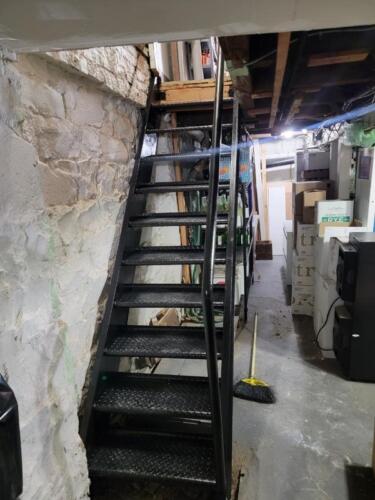 Open tread diamond plate interior fireproof basement store stairs black