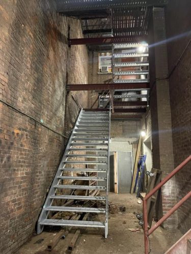 10 flights of galvanized grating stairs, Theatre District