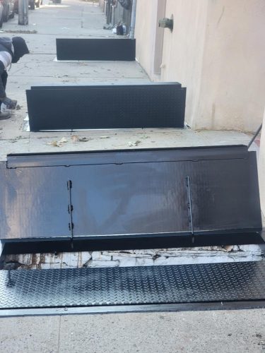 Three flat sidewalk doors installed, Bronx