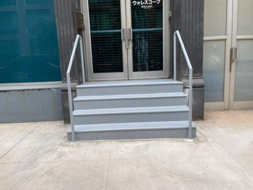 Closed tread diamond plate custom metal stairs endcaps pipe railing, Soho new york city