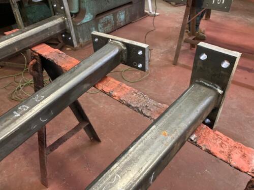 Tube steel columns welded floor plates prepped expansion bolts