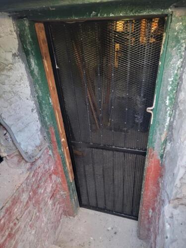 Welded steel expanded security door, East Village